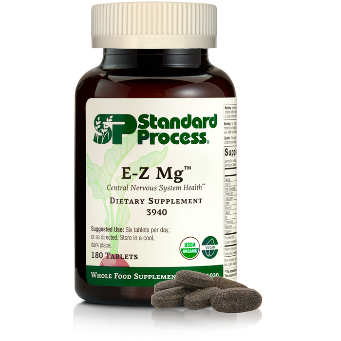 Image of E-Z Mg bottle next to tablets of magnesium supplements.