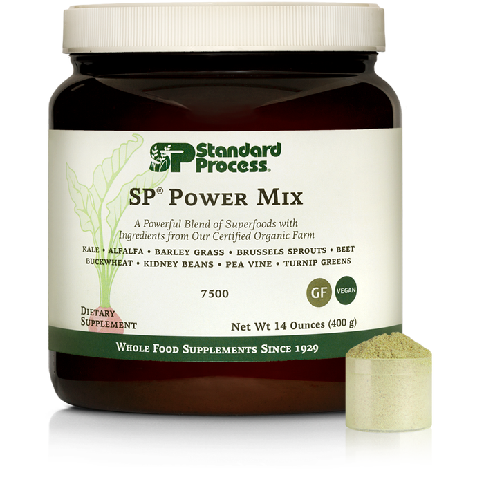 Tub of SP Power Mix next to a scoop of the green powder.