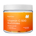 Jar of NutriDyn Vitamin C 500 Gummies with an orange label on a white background