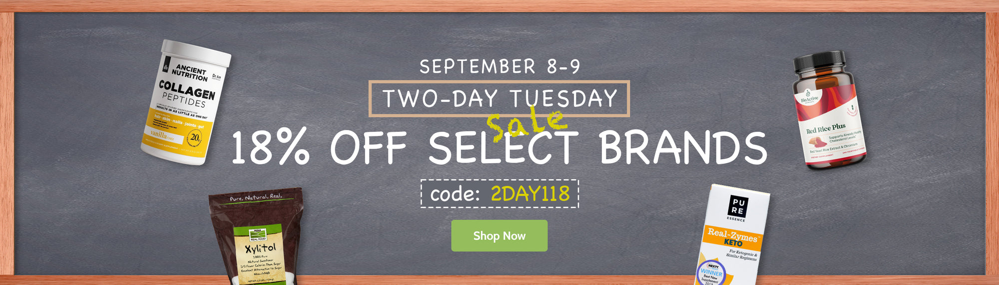 Promotional banner for a two-day event with text reading 'September 8-9, Two-Day Tuesday, 18% Off Select Brands' and 'code: 2DAY18'. Several supplement bottles and boxes are shown around the text on a dark chalkboard-style background with a peach border.