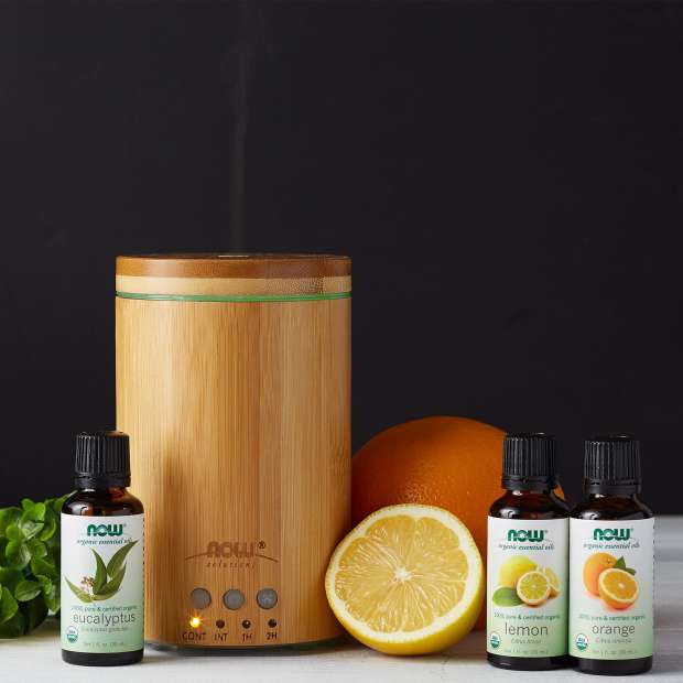 NOW Ultrasonic Oil Diffuser Bamboo Wood shown in a room setting