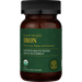 Brown supplement bottle with green label on a white background